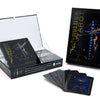The Inner Realms Tarot by Schiffer Publishing, Ltd. is shown with its box and cosmic-themed cards fanned out, ideal for intuitive tarot readers. The packaging and cards are displayed on a white background.
