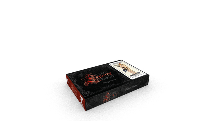 A black and red Tarot Lovers’ Tarot box by Schiffer Publishing, Ltd. rests on a white surface, with a tarot card depicting a figure in light clothing partially visible on top, offering a glimpse into the deck’s card meanings.