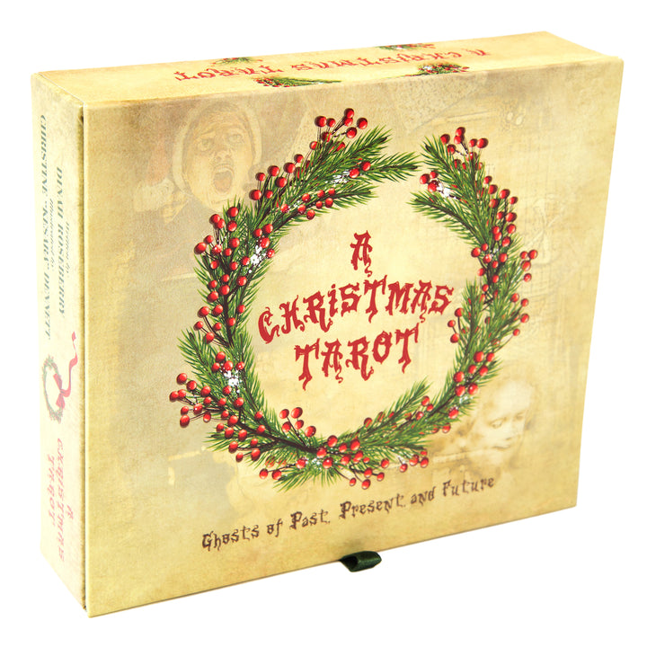 A beige box with red text reading A Christmas Tarot inside a pine and berry wreath. Below, it says Ghosts of Past, Present and Future. This Majors-only deck by Schiffer Publishing, Ltd. has faded images of a child and a shocked person in the background.