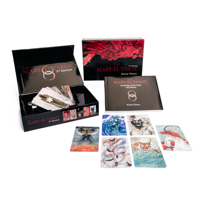 The Mary-El Tarot, 2nd Edition by Schiffer Publishing, Ltd. features a large illustrated box, guidebook, and vivid cards on a white surface—an evocative deck exploring the alchemy of the soul.
