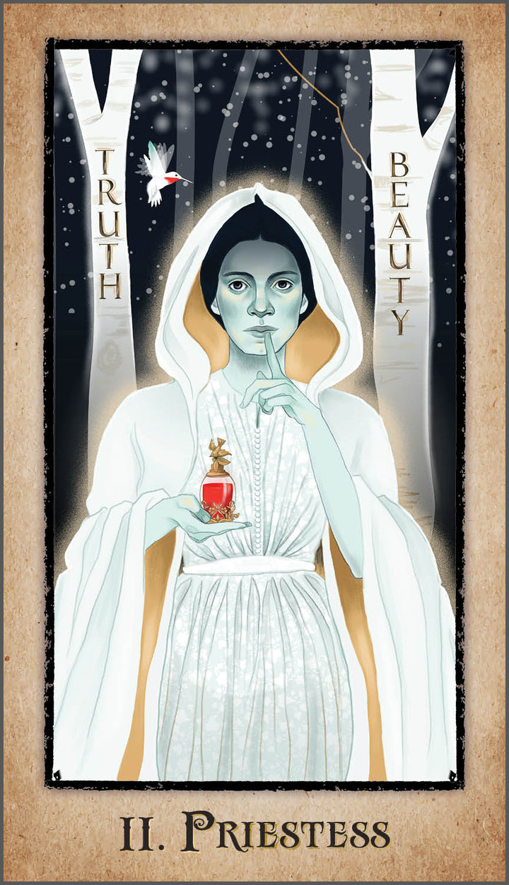 A mystical woman in a white hooded robe stands in a snowy forest with a red potion, as TRUTH and BEAUTY appear on trees—reflecting Transcendentalism—on the II. PRIESTESS card from The American Renaissance Tarot by Schiffer Publishing, Ltd.