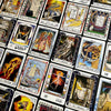A spread of The William Blake Tarot of the Creative Imagination by Schiffer Publishing, Ltd. displays vivid cards with unique artwork and symbols, inspiring creativity against a dark backdrop.