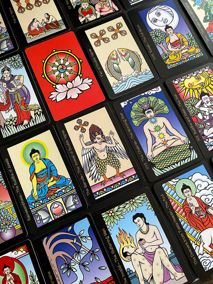 A vibrant spread of The Buddha Tarot by Schiffer Publishing, Ltd. showcases Eastern-inspired illustrations and symbolic figures on each card, including the Major Arcana, arranged neatly in rows.