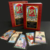 Two boxes of The Buddha Tarot by Schiffer Publishing, Ltd. are behind six vibrant Major Arcana cards with Buddhist-inspired art, all displayed in a row on a black surface against a dark background.