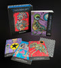 The Outsider Art Tarot by Schiffer Publishing, Ltd. is shown with its box and guidebook. Several vivid, abstract cards featuring intricate outsider art designs are fanned out in front.