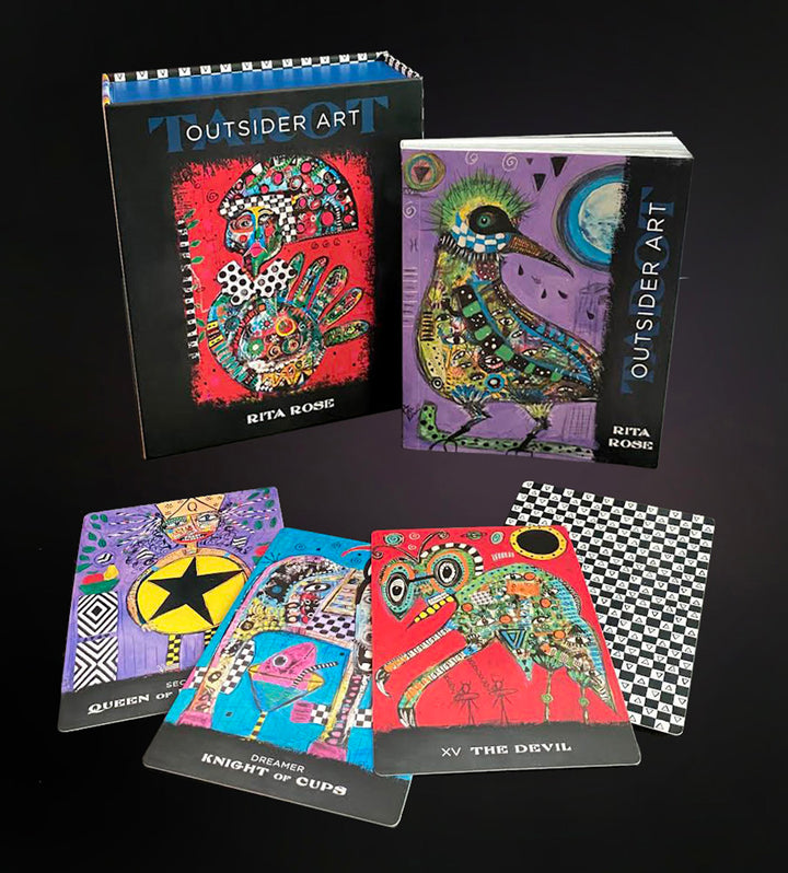 The Outsider Art Tarot by Schiffer Publishing, Ltd. is shown with its box and guidebook. Several vivid, abstract cards featuring intricate outsider art designs are fanned out in front.