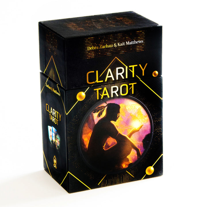 A black Clarity Tarot (Deck and Guidebook Box Set) box by Schiffer Publishing, Ltd. features a seated silhouette against a vibrant background—ideal for cartomancy enthusiasts seeking unique insight.