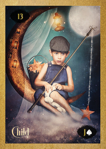 A young boy in overalls and a flat cap sits on a crescent moon with a fishing pole, stars, clouds, and lanterns around him—an enchanting scene from the "Lenormand of Enchantment" deck by Schiffer Publishing, Ltd., marked 13 Child/Jack of Spades.