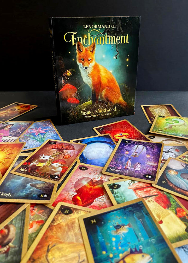 The Lenormand of Enchantment deck and guidebook by Schiffer Publishing, Ltd. features a fox on the cover, with vibrant illustrated cards displayed on a dark surface.