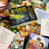 A vibrant Wisdom for Wee Ones box by Schiffer Publishing, Ltd. sits open, surrounded by Proverbs cards with cheerful kids and animals, plus cards featuring uplifting quotes.
