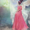 A woman in a pink dress with flowers in her hair sits side-saddle on a winged white unicorn amid glowing light, evoking angelic presence. "Healing" appears at the bottom. From Angels of Healing and Hope Oracle by Schiffer Publishing, Ltd.