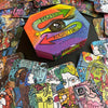 A colorful hexagonal box labeled "Powerful Perspectives" by Schiffer Publishing, Ltd. is shown with vibrant cards featuring diverse abstract faces and designs—ideal for intuitive guidance and empowerment.