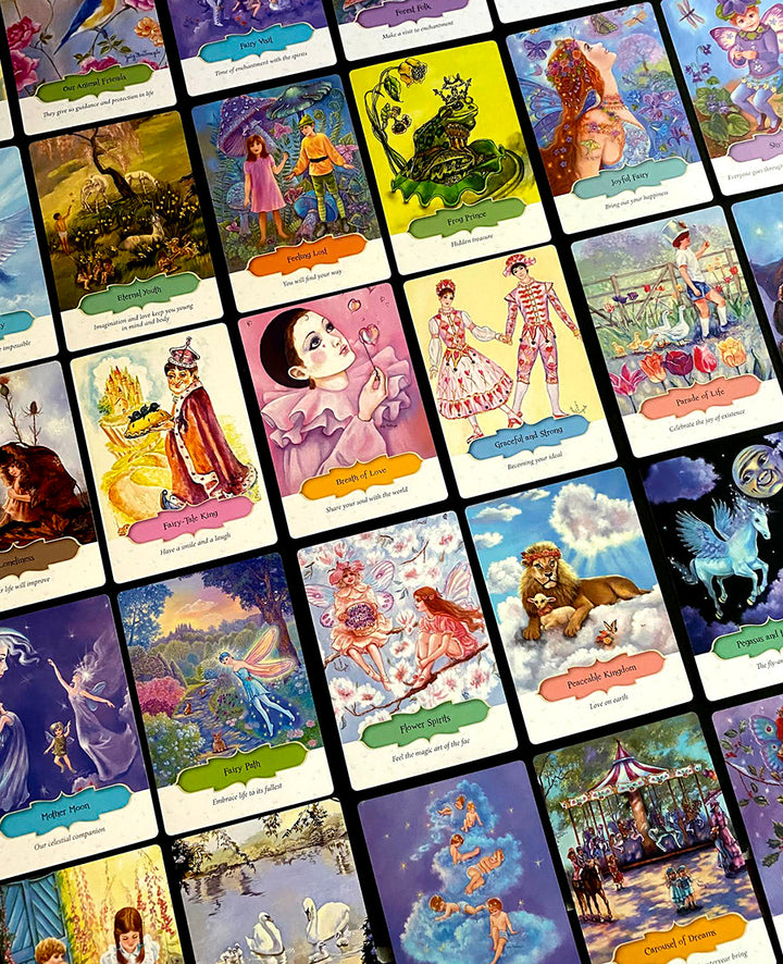 The Dream Your Joy Oracle Cards by Schiffer Publishing, Ltd. features a vibrant spread of whimsical illustrated cards, each with fantasy scenes, characters, and creatures—ideal for dream meditation—with descriptive titles and captions.
