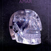 A clear crystal skull with detailed features sits against a dark, textured backdrop. The product, "Oracle of the Crystal Skulls" by Schiffer Publishing, Ltd., features the word AMAR above the skull in purple letters, inspired by oracle card art.