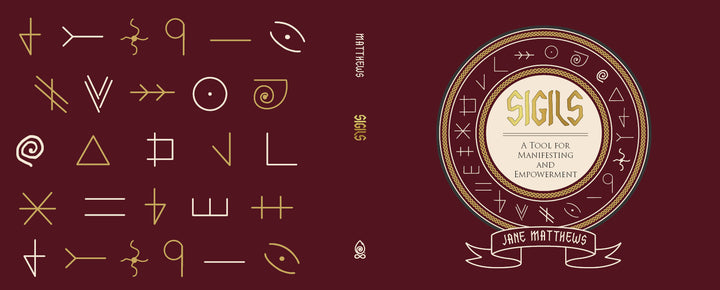 Book cover for Sigils by Schiffer Publishing, Ltd. The maroon design features mystical sigil symbols, a central circular emblem, and the title in the middle, highlighting themes of manifestation and spiritual empowerment.