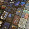 The Shaman’s Way Oracle by Schiffer Publishing, Ltd. is a vibrant shaman oracle deck with intricate animal, symbol, and nature designs displayed in a grid for spiritual healing.