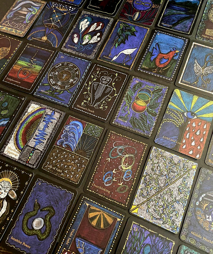The Shaman’s Way Oracle by Schiffer Publishing, Ltd. is a vibrant shaman oracle deck with intricate animal, symbol, and nature designs displayed in a grid for spiritual healing.