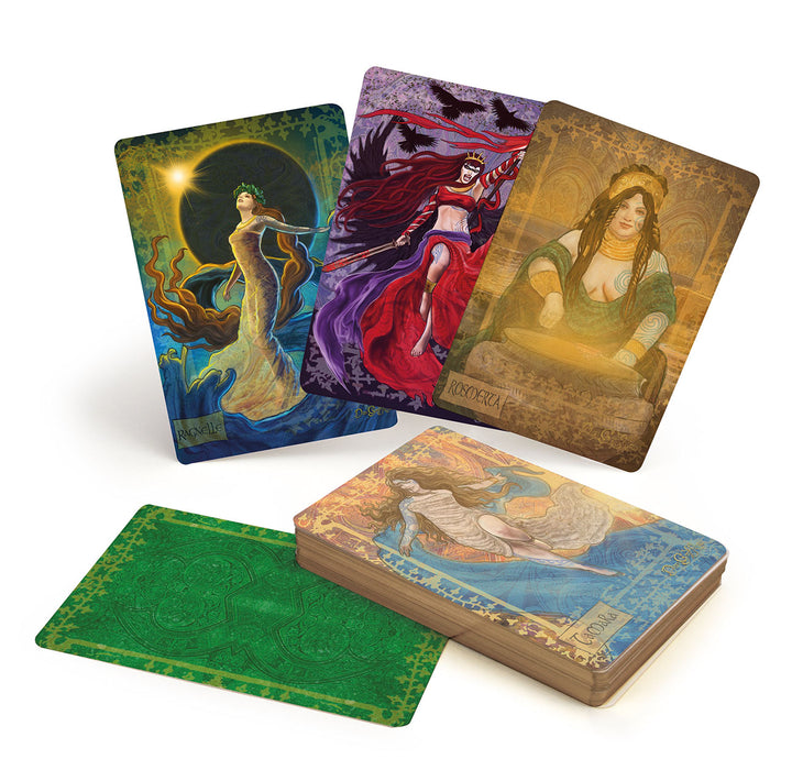 Celtic Goddesses, Witches, and Queens Oracle by Schiffer Publishing, Ltd. features illustrated cards of mystical women—one with swirling water, one in red with ravens, and one with a cauldron—plus a green card back.