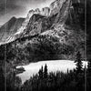 A black and white illustration of mountains, forests, and a calm alpine lake. This nature-inspired card—15. THE ALPINE LAKE—is part of The Bloodlands Oracle by Schiffer Publishing, Ltd.