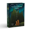 A box for The Liminal Woods Oracle by Schiffer Publishing, Ltd., featuring two foxes sitting together and gazing at a starry sky and northern lights above an enchanted forest.