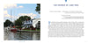 A serene Shores & Islands Ohio getaway by Schiffer Publishing, Ltd.—boats docked along the shore, green trees behind, and white waterfront buildings with red roofs beneath a lightly clouded sky.