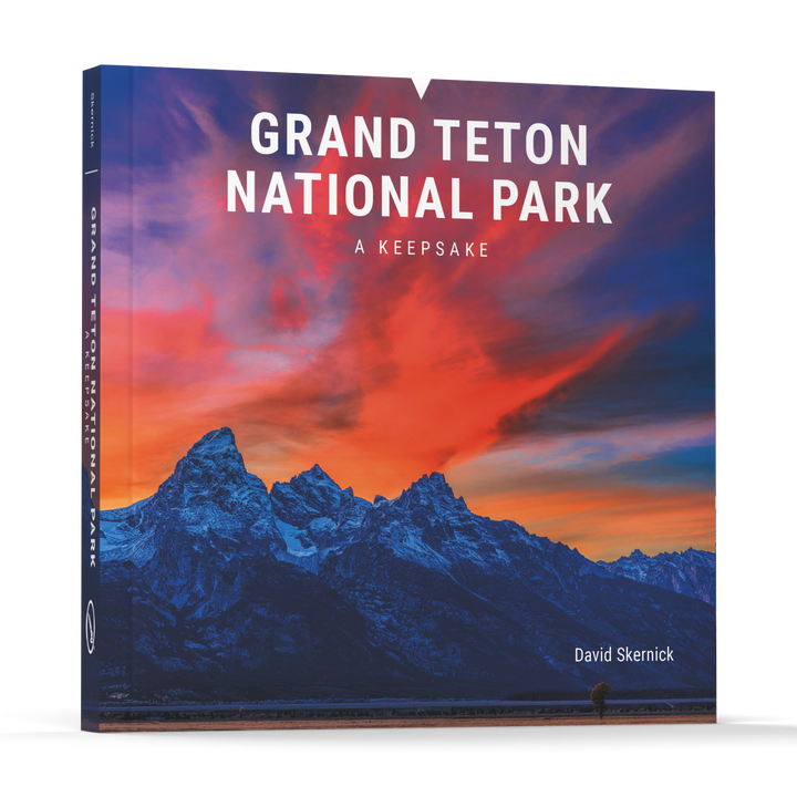 Grand Teton National Park by Schiffer Publishing, Ltd. is a photography book featuring striking images of mountain peaks and sunsets, capturing the breathtaking beauty of Jackson Hole and its surroundings.