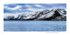 A frozen, blue Jackson Lake with a visible ice crack lies beneath the snow-capped Teton Range under cloudy skies in Grand Teton National Park. © Schiffer Publishing, Ltd.