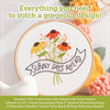 The Sunny Stitches Embroidery Kit Sunny Days Ahead by Schiffer Publishing, Ltd. features a hoop with vibrant stitched flowers and a "Sunny Days Ahead" banner, plus all the hand embroidery supplies you need.