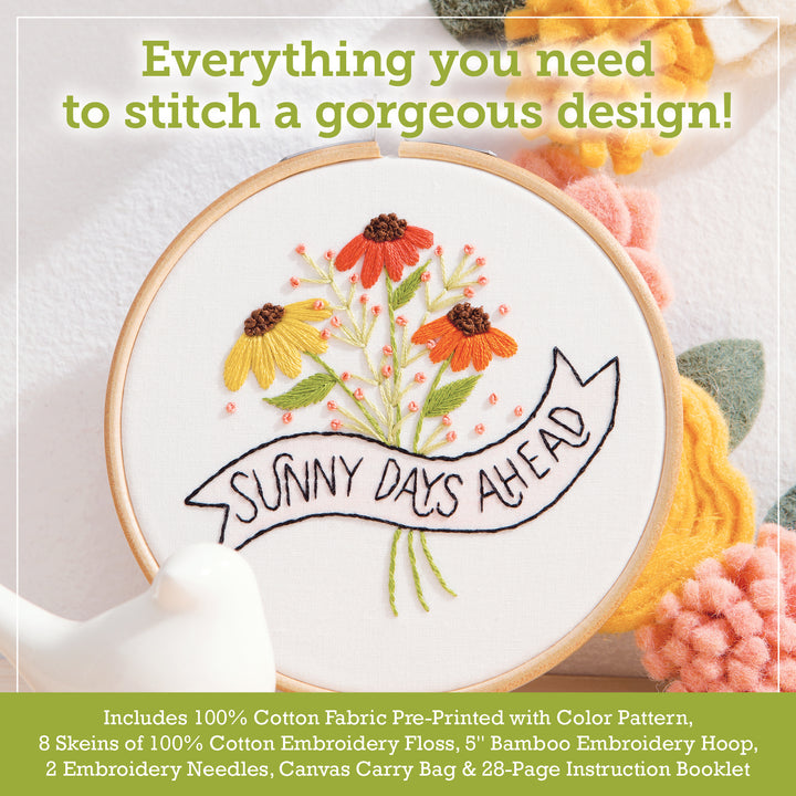 The Sunny Stitches Embroidery Kit Sunny Days Ahead by Schiffer Publishing, Ltd. features a hoop with vibrant stitched flowers and a "Sunny Days Ahead" banner, plus all the hand embroidery supplies you need.