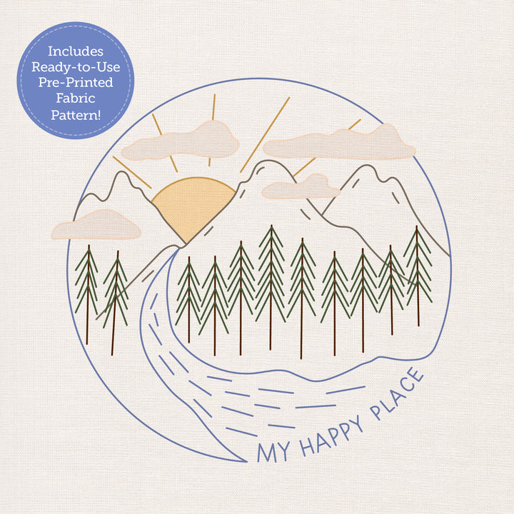 The Sunny Stitches Embroidery Kit Sunshine Pines by Schiffer Publishing, Ltd. features mountains, river, pines, sun, and clouds with "MY HAPPY PLACE" below. Includes a blue label: Ready-to-Use Pre-Printed Fabric Pattern—ideal for embroidery lovers!.