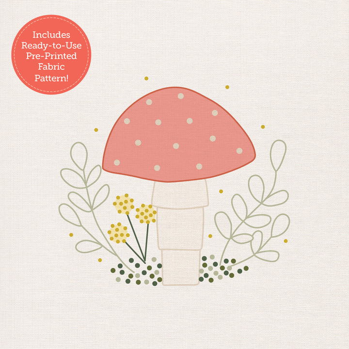 The Sunny Stitches Embroidery Kit Woodland Mushroom by Schiffer Publishing, Ltd. features a pink and white mushroom among green leaves and yellow flowers. Includes a ready-to-use pre-printed fabric pattern—just start stitching!.
