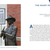 Bronze statue of Bill Monroe standing by the Birth of Bluegrass historical marker near the Ryman Auditorium, a scene from the Nashville travel guide.