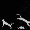 Silhouettes of two Schiffer Publishing, Ltd. Cats chase a yellow ball on black, with motion trails labeled Fritzly and Fluffy. Their outlines suggest speed and playful paper-folding, echoing animated black cats in motion.
