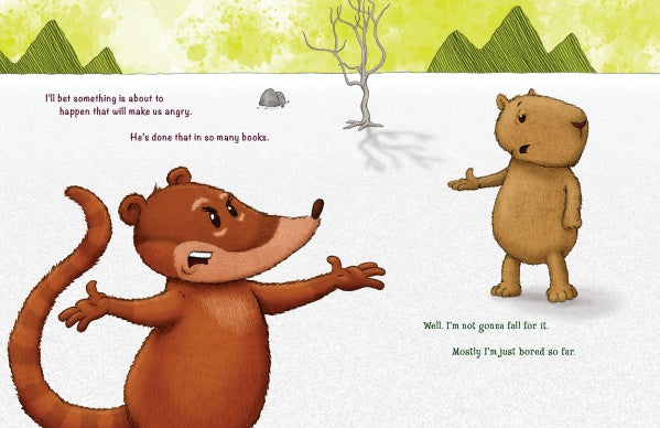 An illustration from "Untitled" by Schiffer Publishing, Ltd. features a frustrated coatimundi and a calm capybara in snow by a barren tree and hills, with dialogue above them that hints at a playful story.