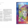 A magazine page from Schiffer Publishing, Ltd.’s "HERstory Quilts" features a colorful fiber art portrait of comedian Phyllis Diller with her bright hair and feather boa, celebrating the achievements of extraordinary women.