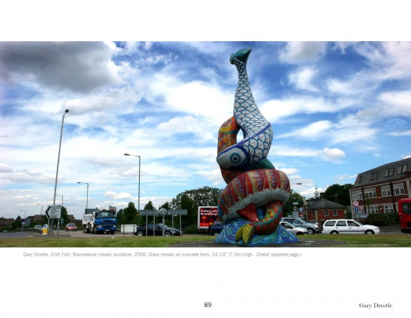 Mosaic Art Today by Schiffer Publishing, Ltd. features vibrant contemporary mosaic sculptures—like two intertwined fish crafted from colorful tesserae, displayed under a partly cloudy sky at a city roundabout.