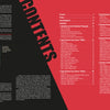 A two-page spread from "The Secret History of KGB Spy Cameras" (Schiffer Publishing, Ltd.) shows a red and black table of contents listing chapters, beside a photo of a man in uniform with text on Cold War espionage and a descriptive caption.