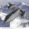 A black SR-71B aircraft flies over snowy mountains in NASA aerospace research and Space Shuttle development, displaying fuel streaks and filler openings. From "NASA: Space Flight Research and Pioneering Developments" by Schiffer Publishing, Ltd.