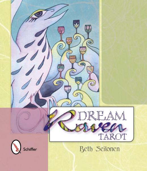 The Dream Raven Tarot from Schiffer Publishing, Ltd. displays a stylized white raven with blue markings next to a whimsical tree of colorful cups on its pastel-hued cover.