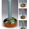 Painting Gourds with the Fairy Gourdmother® by Schiffer Publishing, Ltd. features a tall, upright blue-green cactus sculpture with star-like motifs and a round base decorated with painted succulents and flowers. Multiple angles are shown.
