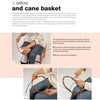 A person weaves a round cane basket using willow rods, demonstrating basketry with detailed hand techniques. "Basketry" by Schiffer Publishing, Ltd. features step-by-step instructions and three small tutorial photos on a soft pink and white layout.