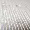 A table of contents from "Weaving" by Schiffer Publishing, Ltd. overlays a blurred backdrop of white threads, listing handwoven textile techniques, zero-waste projects, and acknowledgments with their page numbers.