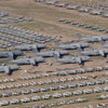 Desert Boneyard by Schiffer Publishing, Ltd. features rows of retired military aircraft and jets neatly lined up on a dry, grassy field for efficient storage of various sizes and types.