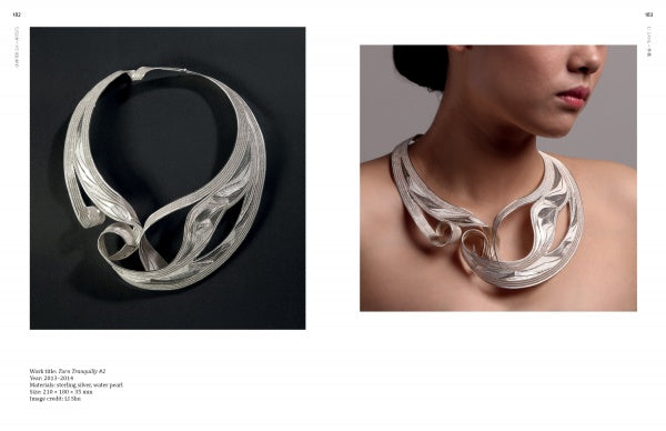 The book "Chinese Contemporary Jewelry Design" by Schiffer Publishing, Ltd. features a sculptural silver necklace with wave-like curves, shown both on a black background and worn to highlight its intricate, modern style.