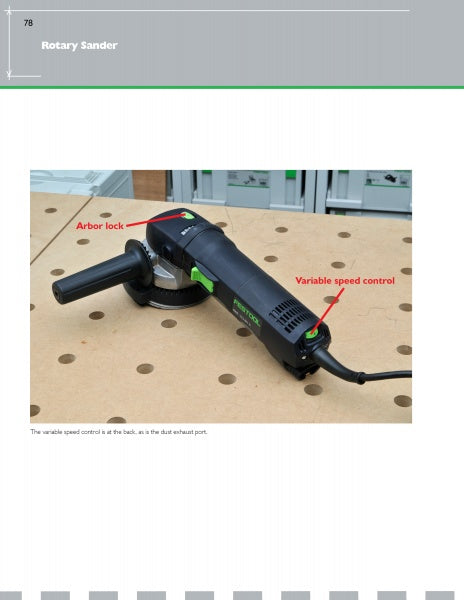 A black rotary sander from Festool®Essentials: The Sanders by Schiffer Publishing, Ltd. sits on a perforated workbench. Red arrows highlight the arbor lock by the handle and variable speed control at the rear; shelving is in the background.