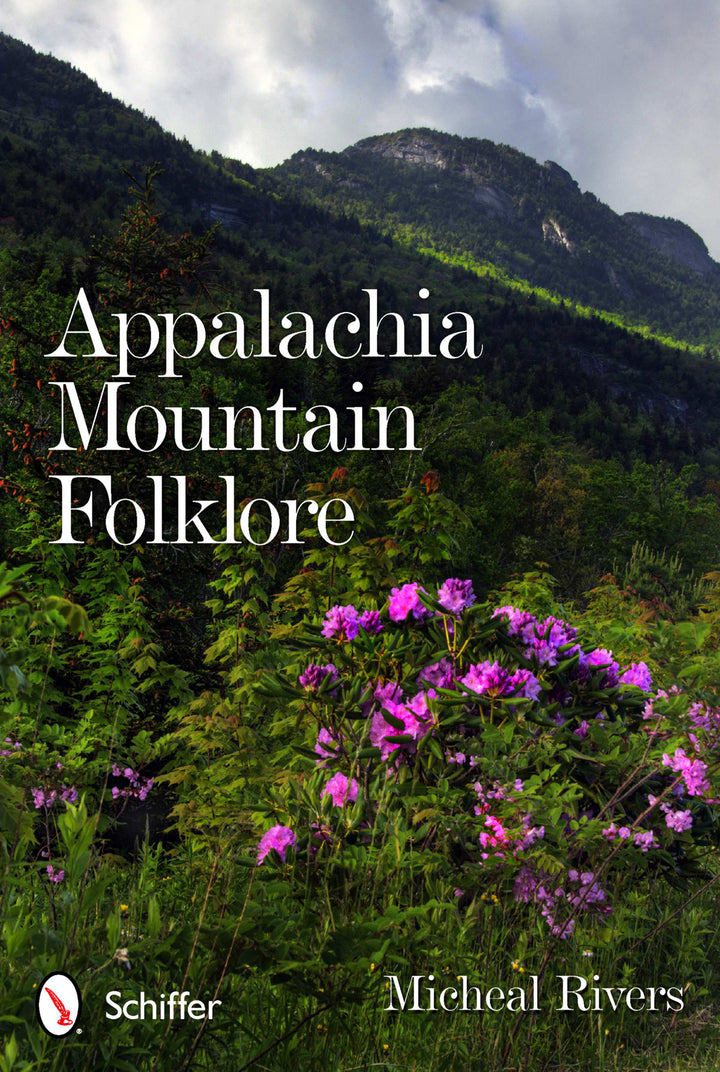 Book cover for Appalachia Mountain Folklore by Schiffer Publishing, Ltd., featuring a scenic mountain landscape with green trees, rocky cliffs, and blooming purple flowers that reflect the spirit of Appalachian folklore and ghost stories.