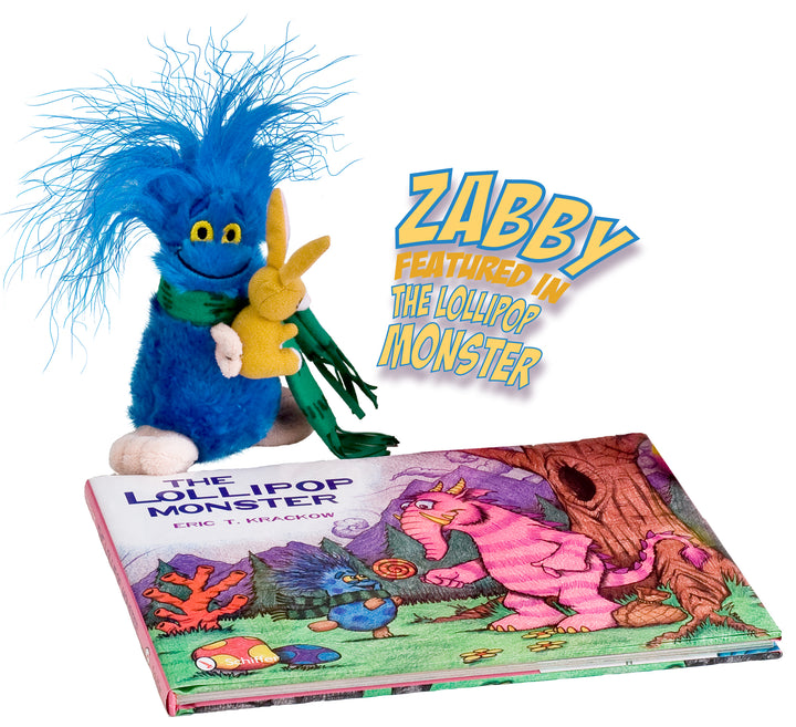 A blue Zabby? plush toy by Schiffer Publishing, featuring wild hair and a green scarf, holds a yellow bunny plush beside the colorful Lollipop Monster book. Text reads: Zabby? plush toy featured in The Lollipop Monster.