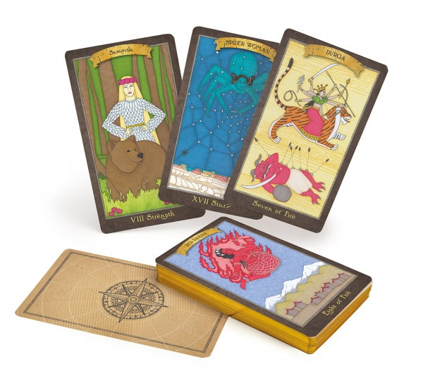 Three illustrated cards from the Dark Goddess Tarot by Schiffer Publishing, Ltd.—Strength (woman and bear), Spider Woman, and Duroa—stand behind a face-down card and a deck with a red crab, celebrating the sacred feminine.