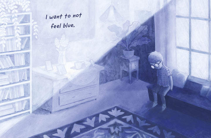 A lonely child with glasses sits on a windowsill in a blue-tinted room, sunlight shining in. Inspired by the autism book *I Am Odd, I Am New* from Schiffer Publishing, Ltd., text reads: "I want to not feel blue.