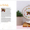 Sunny Stitches by Schiffer Publishing, Ltd. features a vibrant butterfly and floral embroidery hoop displayed beside a potted succulent and embroidery book with clear instructional text and stitch guide, ideal for beginner embroidery projects.